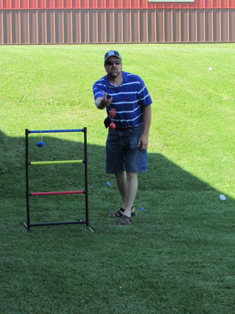 A man playing Ladder Ball