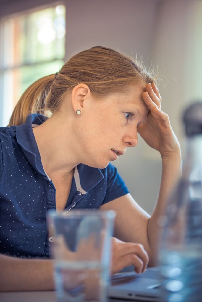 woman sitting looking stressed