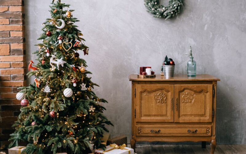 Christmas tree with presents and a credenza