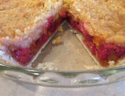 Cherry Peach Pie with a slice out of it