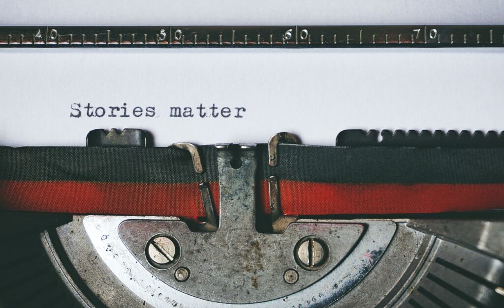 typewriter with words typed stories matter