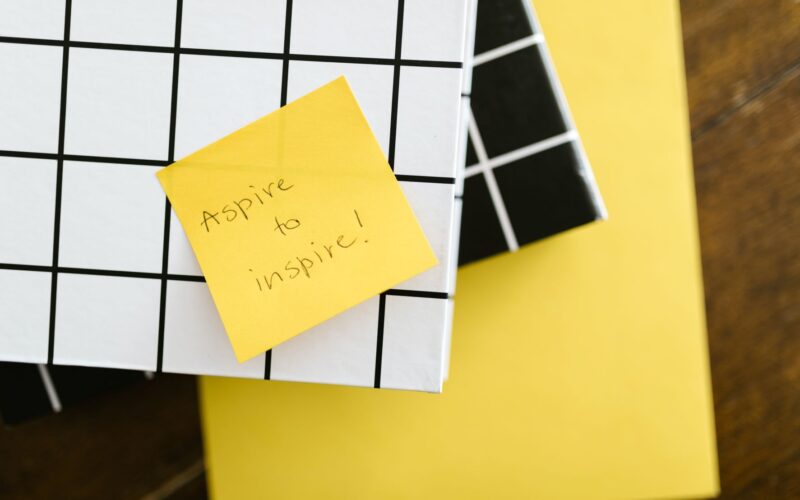 Post it not with the words Aspire to Inspire