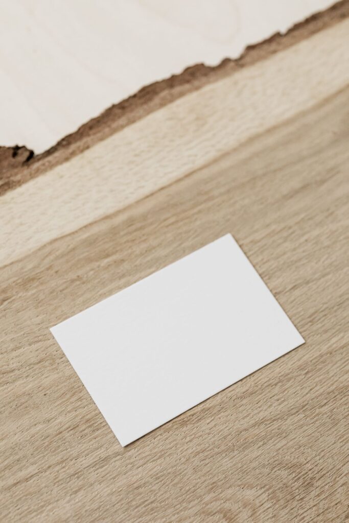 Index card laying on wood slab