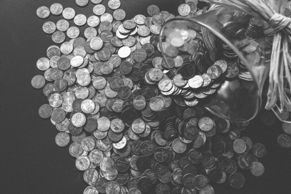 Coin money poured out in black and white