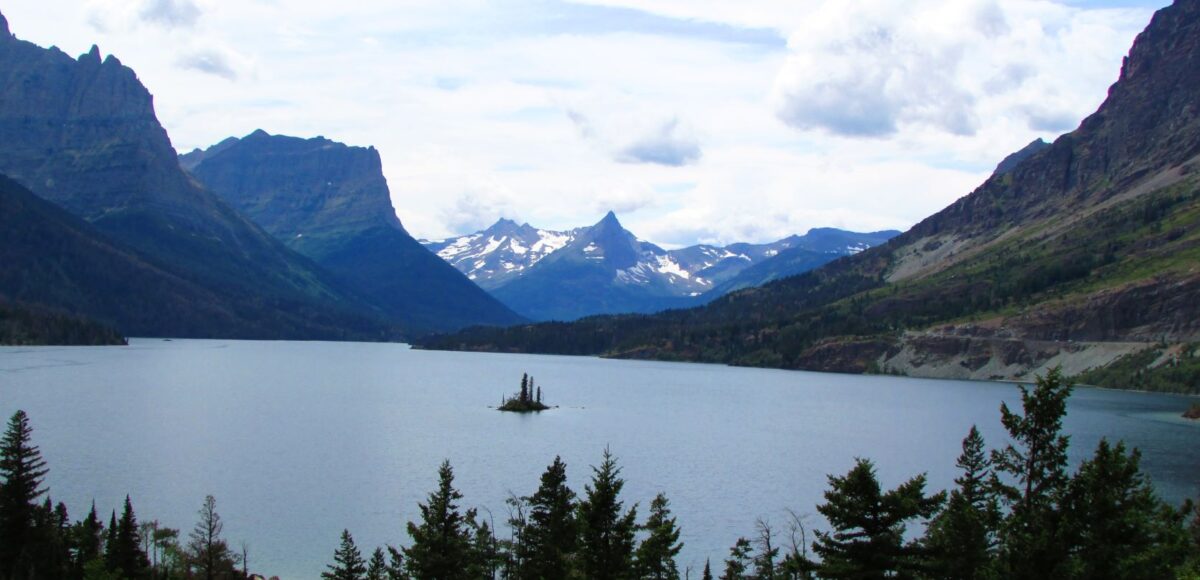 mountain lake with tiny island in the middle