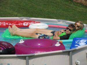 kids floating in the pool