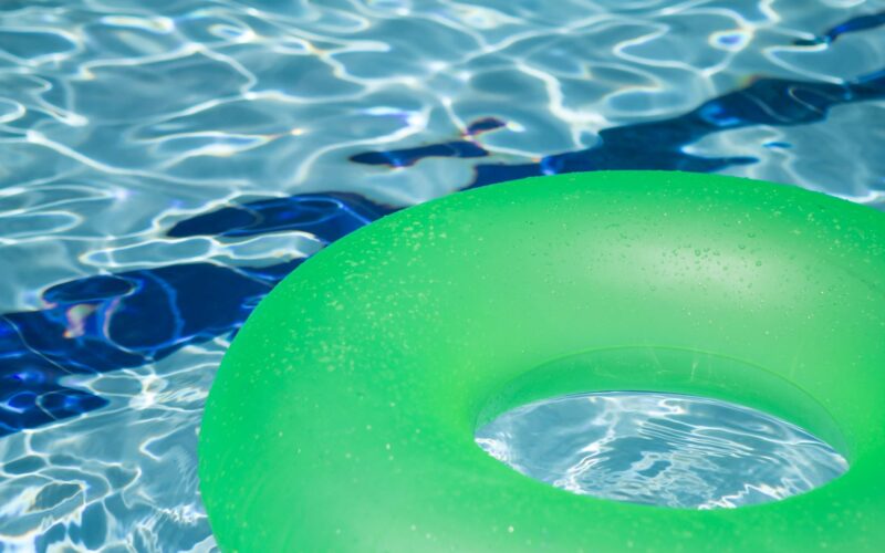 inflatable green ring floating in pool